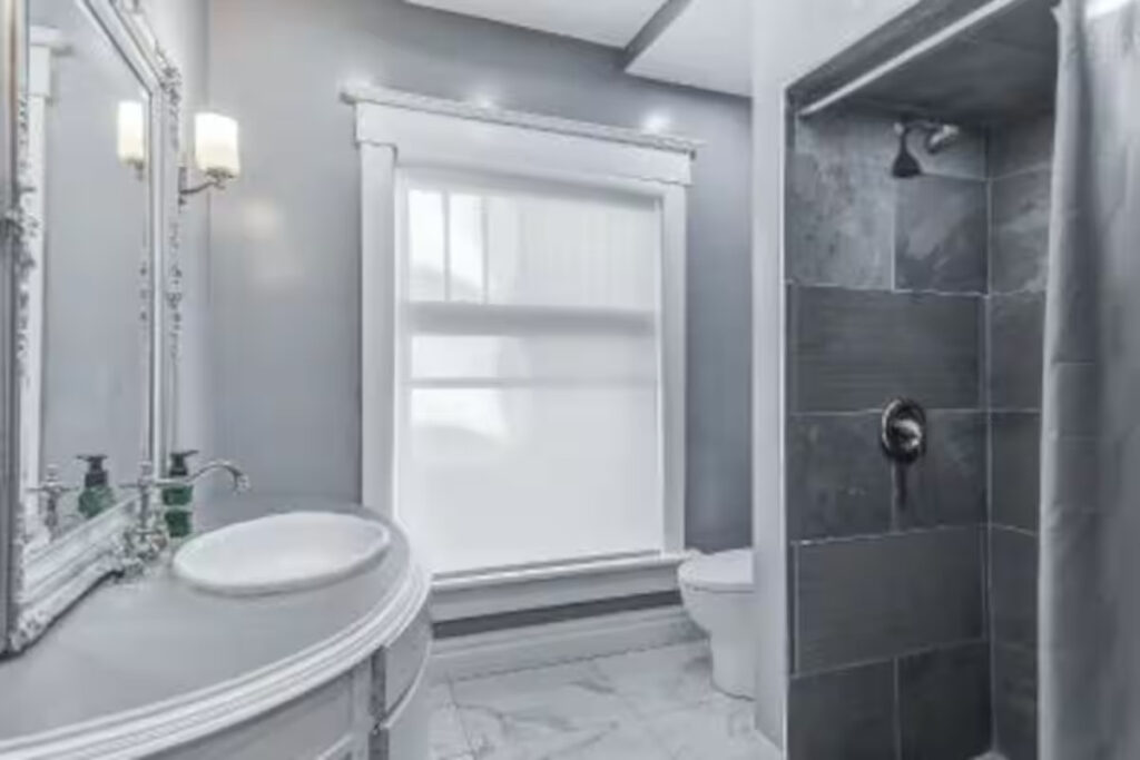 Full bathroom with a glass walk-in shower in a Niagara Falls furnished rental